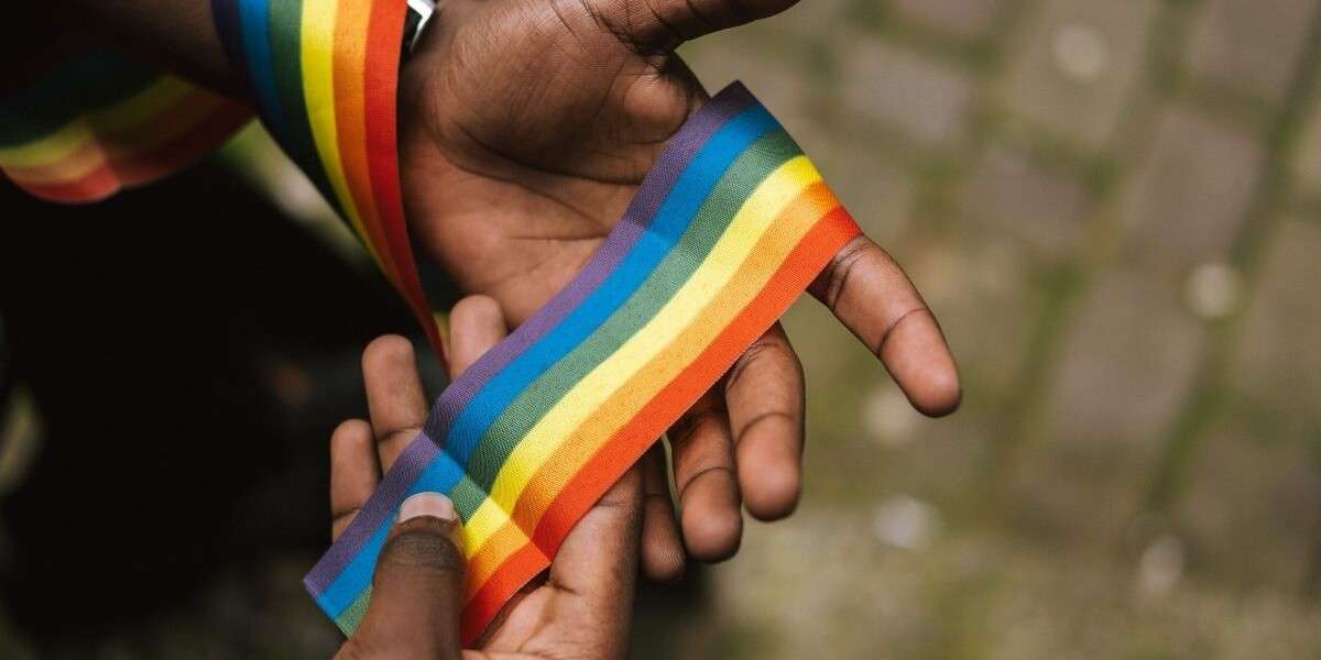 rainbow flag and black hands